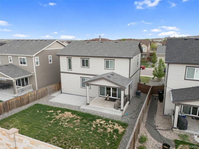16369 Alberta Dr, Parker, CO 80134 - back of property with a residential view, a patio area, central air condition unit, and a shingled roof