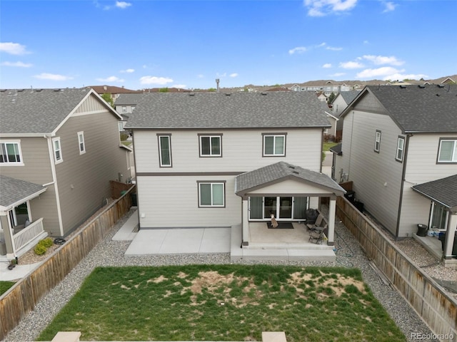 16369 Alberta Dr, Parker, CO 80134 - back of property featuring a patio area, a residential view, and a shingled roof