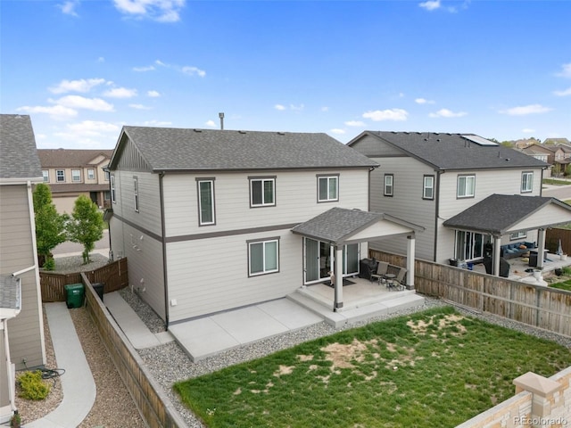 16369 Alberta Dr, Parker, CO 80134 - back of property with a patio, a residential view, and a shingled roof