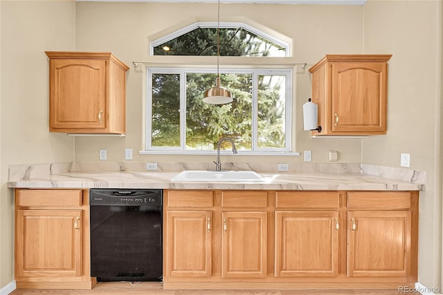 7870 Sunflower Grn Unit 151, Frederick, CO 80530 - kitchen with dishwasher, a sink, and light brown cabinets