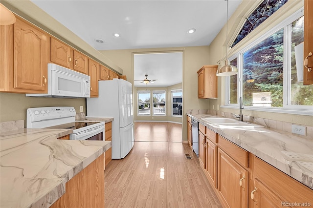 7870 Sunflower Grn Unit 151, Frederick, CO 80530 - kitchen with white appliances, light wood-style flooring, light stone countertops, a sink, and a ceiling fan