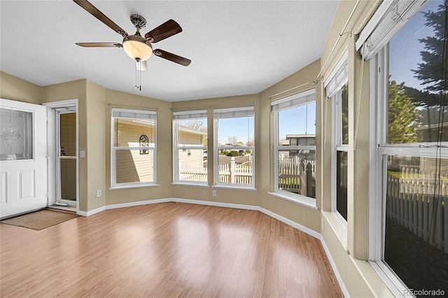 7870 Sunflower Grn Unit 151, Frederick, CO 80530 - unfurnished sunroom featuring wood finished floors and baseboards