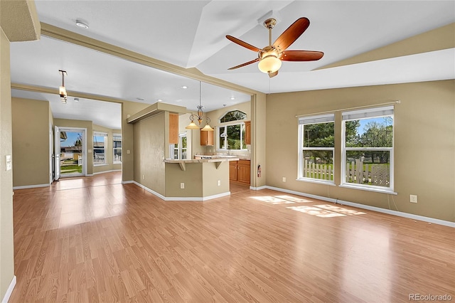 7870 Sunflower Grn Unit 151, Frederick, CO 80530 - unfurnished living room with vaulted ceiling, a ceiling fan, light wood-style floors, baseboards, and recessed lighting