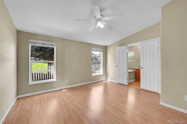 7870 Sunflower Grn Unit 151, Frederick, CO 80530 - spare room with light wood-style floors, ceiling fan, baseboards, and vaulted ceiling