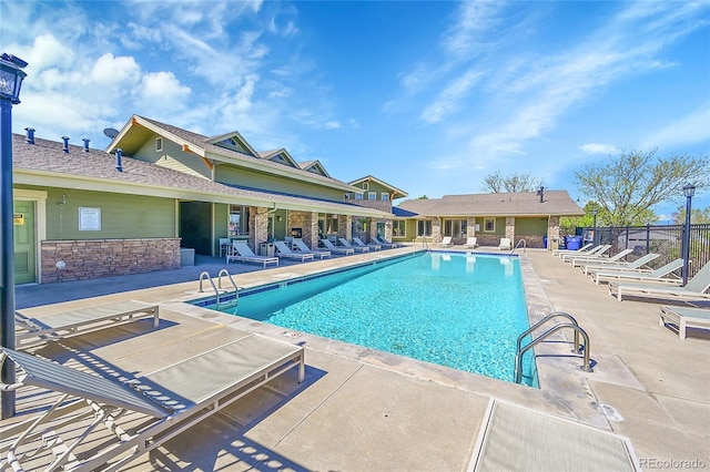 7870 Sunflower Grn Unit 151, Frederick, CO 80530 - community pool with a patio area and fence