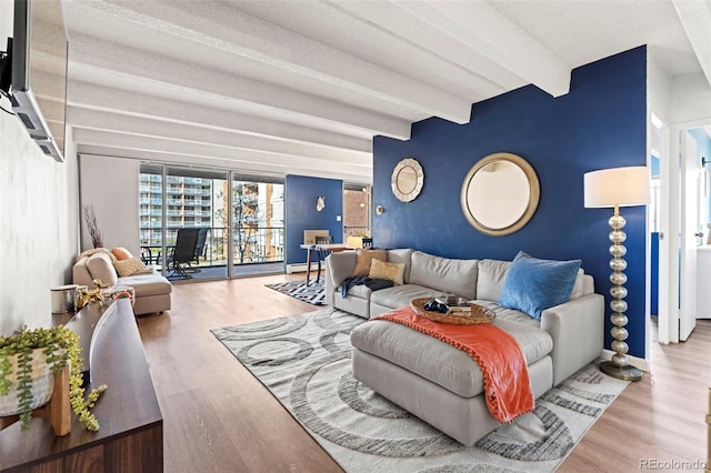 living room featuring hardwood / wood-style floors and beam ceiling