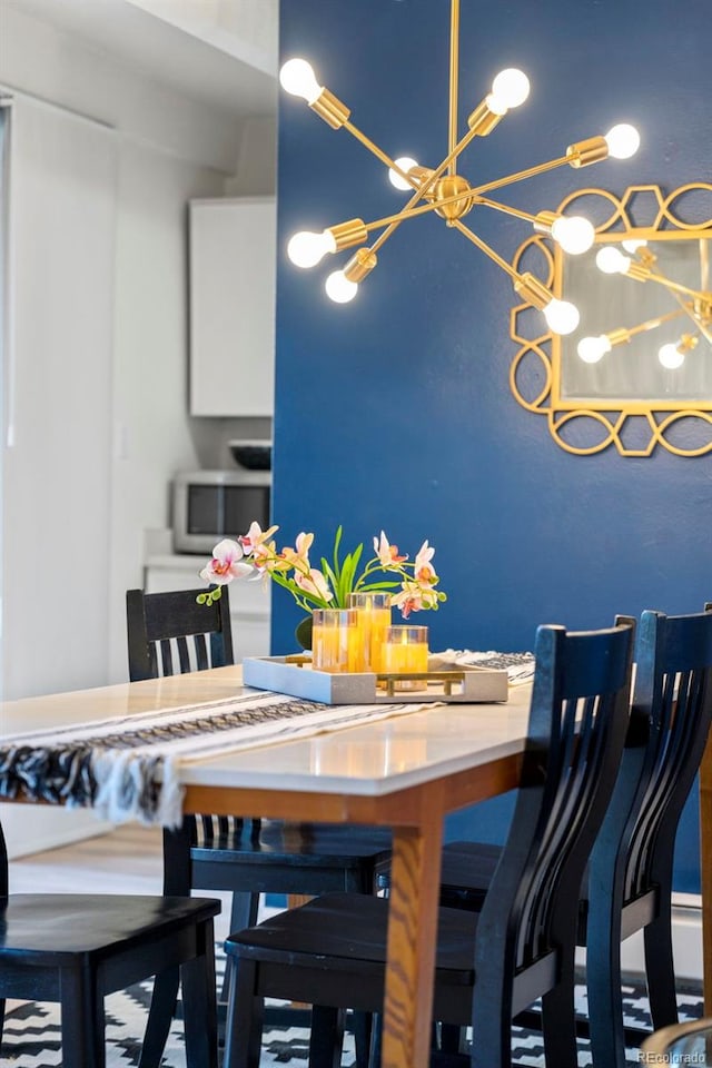 dining area featuring a chandelier