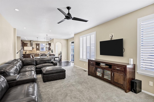 living room with a ceiling fan, light carpet, plenty of natural light, and recessed lighting