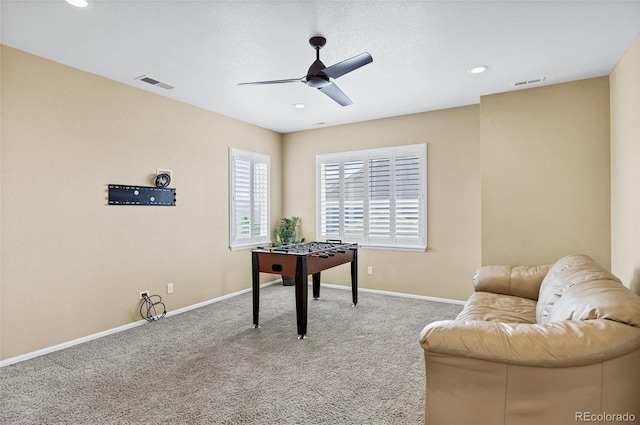 sitting room with ceiling fan, carpet floors, baseboards, and recessed lighting
