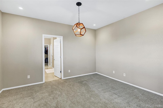 carpeted spare room with baseboards and recessed lighting