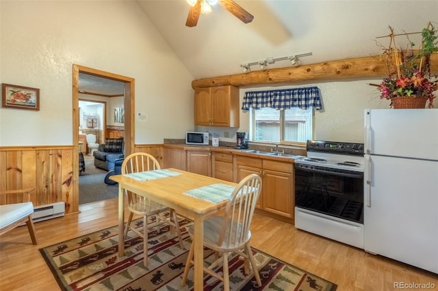 kitchen featuring sink, white appliances, light hardwood / wood-style flooring, and light brown cabinets