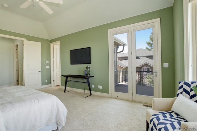 bedroom with visible vents, lofted ceiling, carpet floors, baseboards, and access to exterior