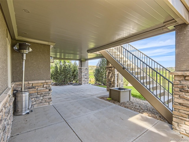 view of patio / terrace featuring stairs