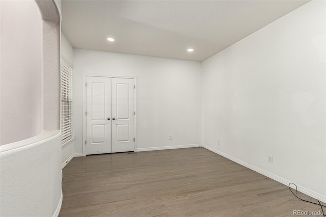 empty room featuring hardwood / wood-style flooring