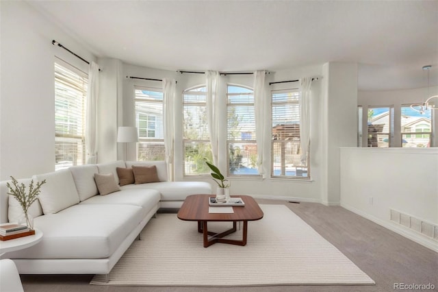 interior space with plenty of natural light and a chandelier