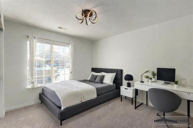 bedroom featuring light carpet