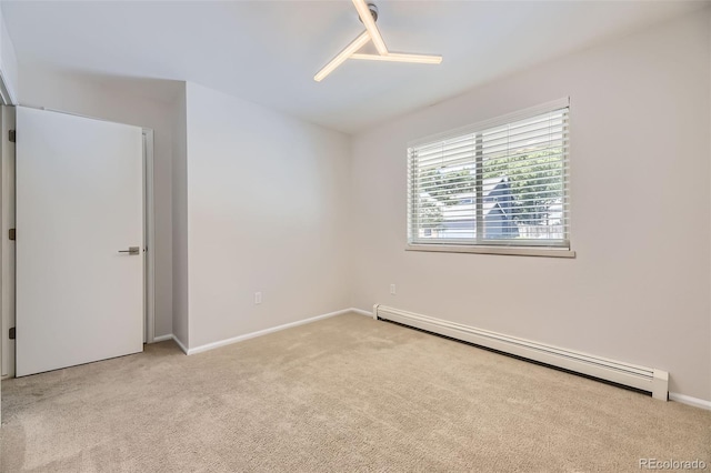 8414 S Otis St, Littleton, CO 80128 - spare room featuring a baseboard radiator and light colored carpet