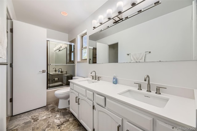 8414 S Otis St, Littleton, CO 80128 - full bathroom featuring double vanity, enclosed tub / shower combo, and recessed lighting