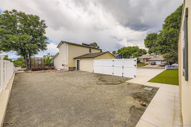 8414 S Otis St, Littleton, CO 80128 - view of side of property featuring a gate and a fenced backyard