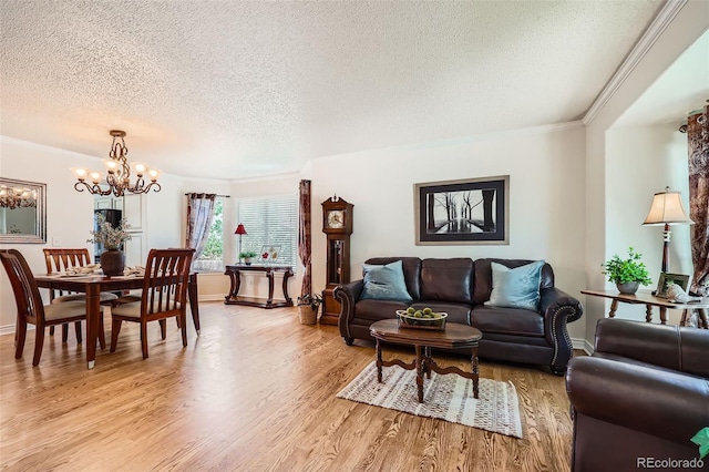5133 E Essex Ave, Castle Rock, CO 80104 - living area featuring a textured ceiling, a chandelier, light wood-style floors, and ornamental molding