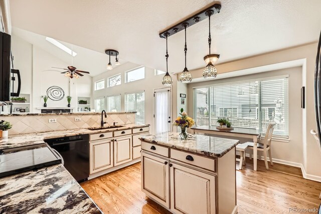 5133 E Essex Ave, Castle Rock, CO 80104 - kitchen with dishwasher, light wood-style floors, healthy amount of natural light, and vaulted ceiling
