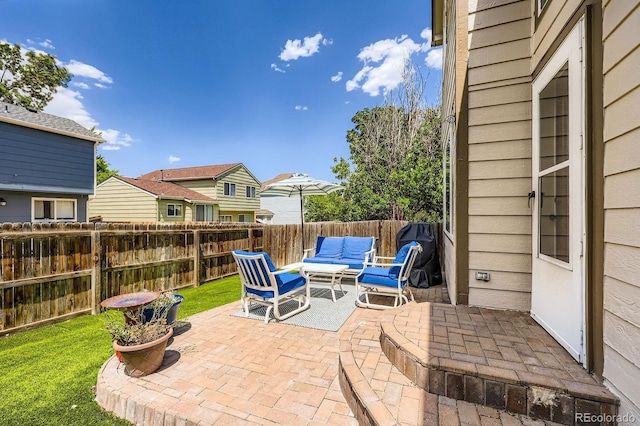 5133 E Essex Ave, Castle Rock, CO 80104 - fenced backyard with an outdoor hangout area, a patio, and a residential view