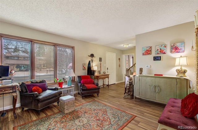 3006 Oro Blanco Dr, Colorado Springs, CO 80917 - living area with baseboards, wood finished floors, and a textured ceiling