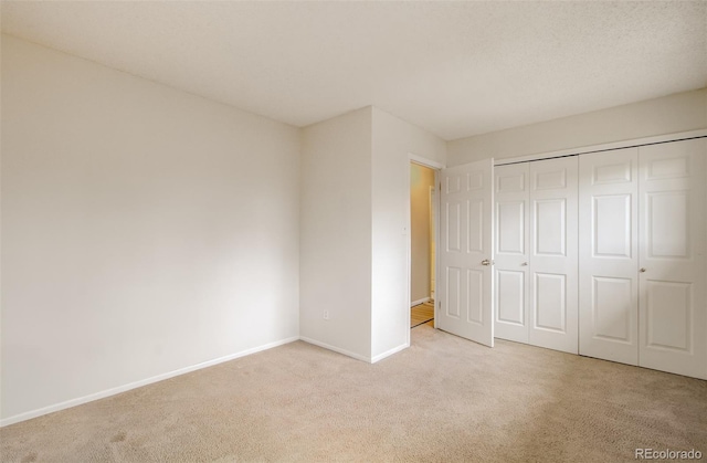 3006 Oro Blanco Dr, Colorado Springs, CO 80917 - unfurnished bedroom with baseboards, carpet, and a closet