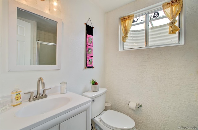 3006 Oro Blanco Dr, Colorado Springs, CO 80917 - full bath featuring a shower stall, toilet, and vanity