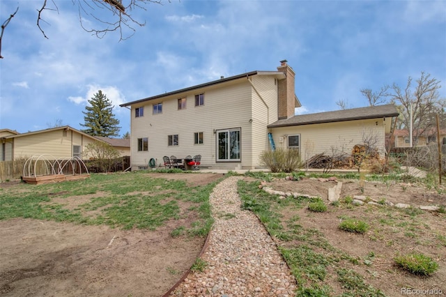 3006 Oro Blanco Dr, Colorado Springs, CO 80917 - back of property featuring a chimney