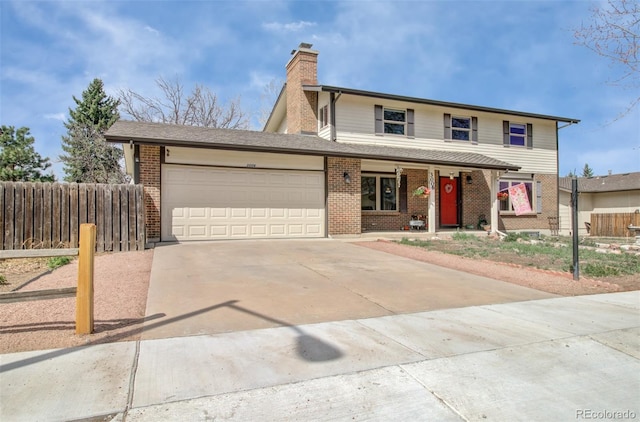 3006 Oro Blanco Dr, Colorado Springs, CO 80917 - traditional-style house with concrete driveway, fence, a porch, a garage, and brick siding