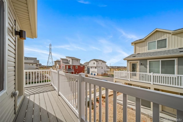 wooden deck with a residential view