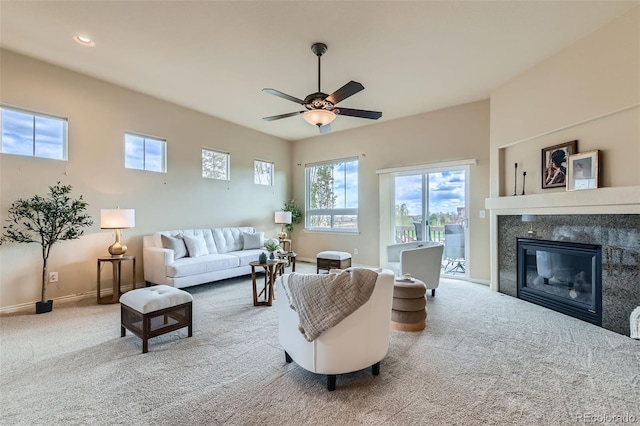 living room featuring ceiling fan, carpet, recessed lighting, baseboards, and a high end fireplace