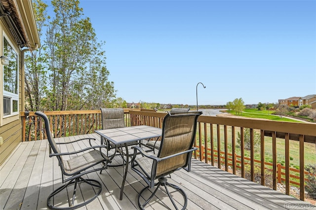 deck with outdoor dining area