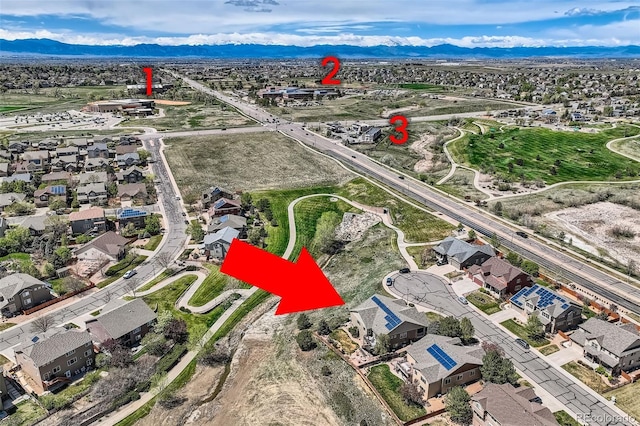bird's eye view with a residential view and a mountain view
