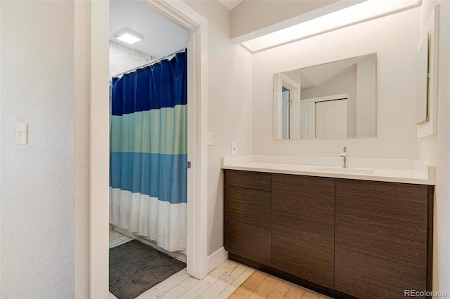 bathroom featuring vanity, curtained shower, and hardwood / wood-style floors