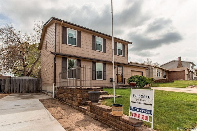 view of front of home featuring concrete driveway