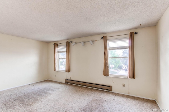 empty room featuring a baseboard radiator, a textured ceiling, carpet flooring, and baseboards
