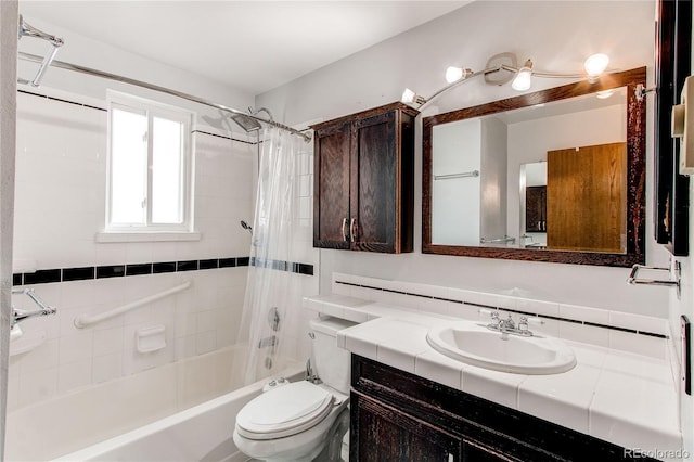 bathroom with shower / tub combo, toilet, and vanity