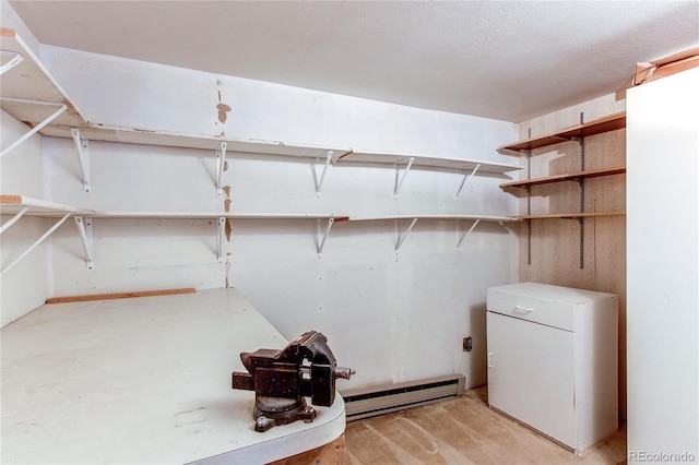 laundry area with baseboard heating