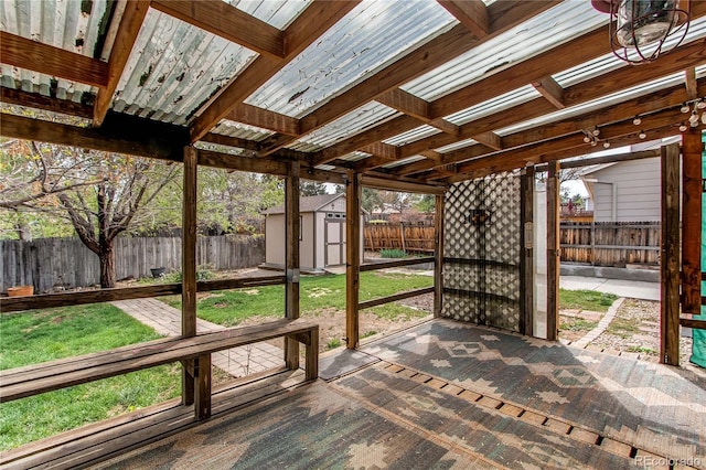 view of patio / terrace featuring a storage unit and an outdoor structure