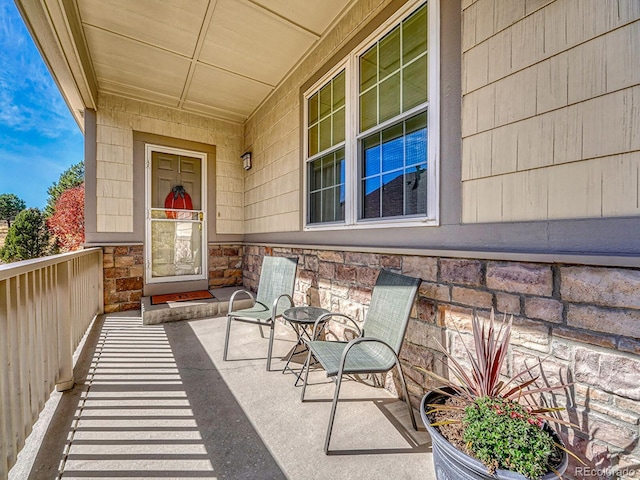 view of exterior entry with covered porch