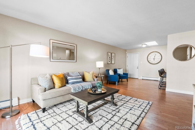 living room with hardwood / wood-style flooring and a baseboard radiator