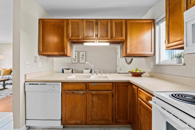 kitchen with sink and white appliances