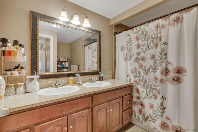 full bath with double vanity and a sink