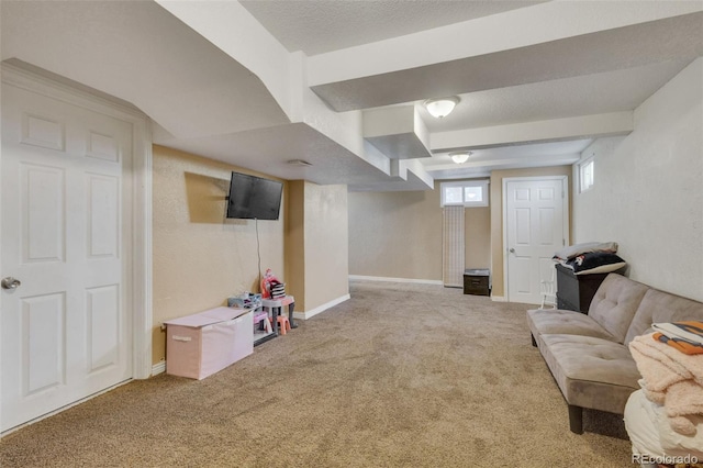 interior space featuring a textured ceiling, baseboards, and carpet floors