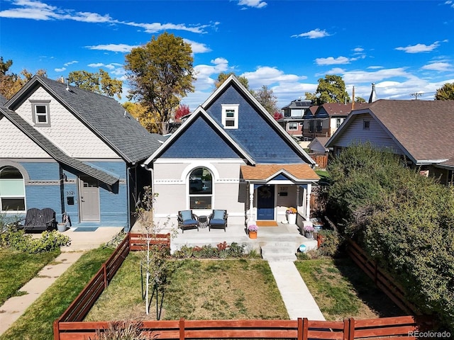 3317 W 37th Ave, Denver, CO 80211 - view of front of house featuring a front lawn, covered porch, and a fenced front yard