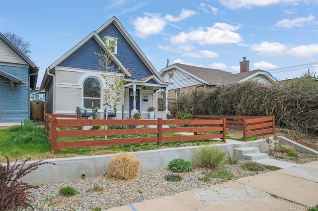3317 W 37th Ave, Denver, CO 80211 - view of front of home featuring covered porch and a fenced front yard