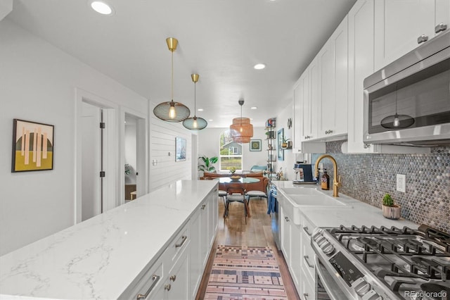 3317 W 37th Ave, Denver, CO 80211 - kitchen featuring white cabinets, appliances with stainless steel finishes, recessed lighting, and a sink