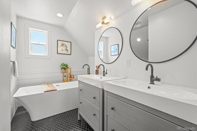 3317 W 37th Ave, Denver, CO 80211 - full bath featuring vaulted ceiling, a sink, double vanity, and a freestanding bath